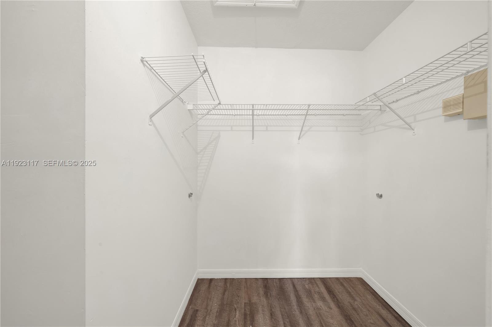 3385 Northeast 10th Street, Unit 201 Homestead, FL 33033 - Photo 10 of 15 a view of a room with racks on the wall