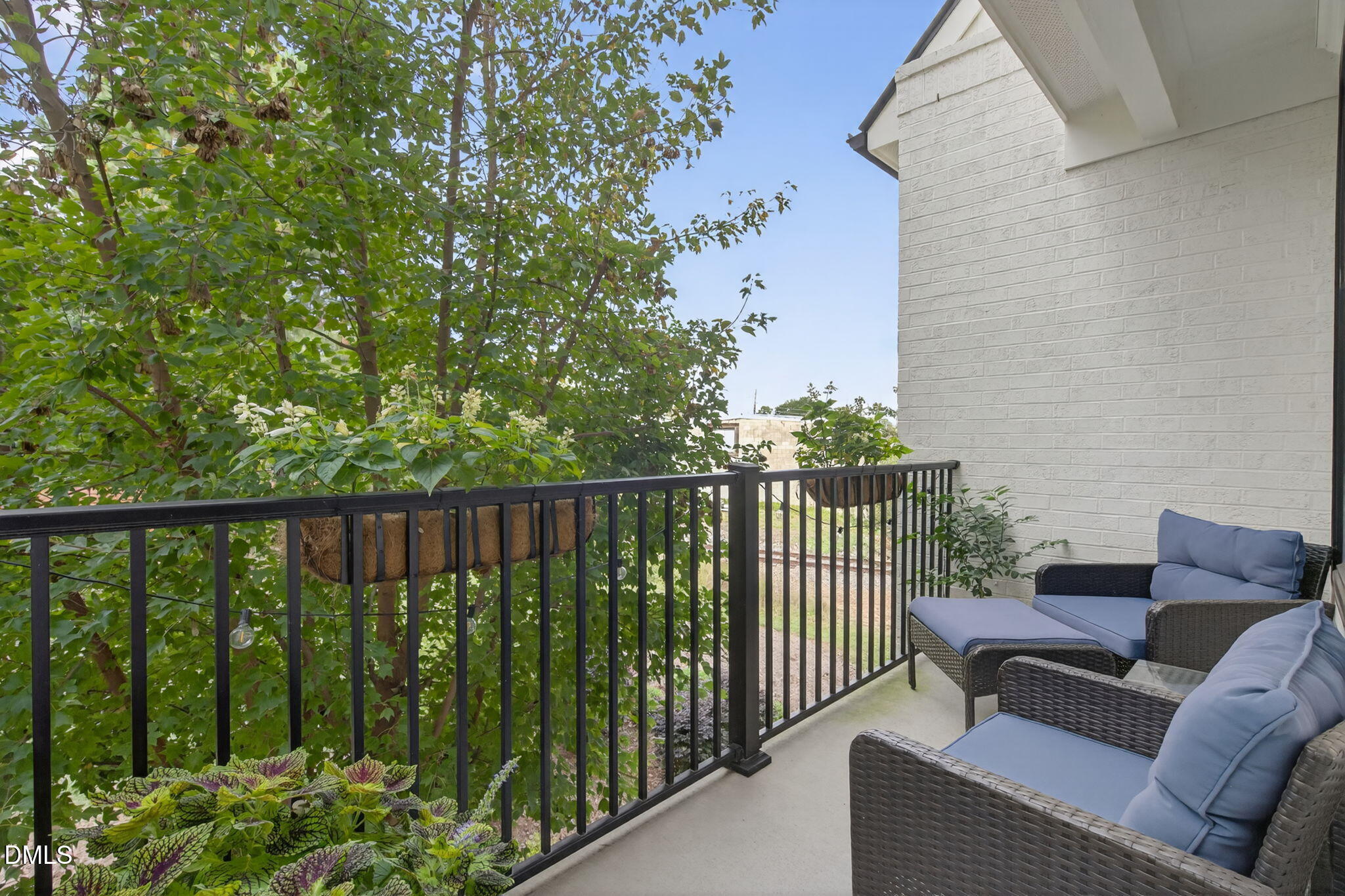 1610 Draper View Loop, Unit 102 Raleigh, NC 27608 - Photo 18 of 40 a view of a balcony with furniture