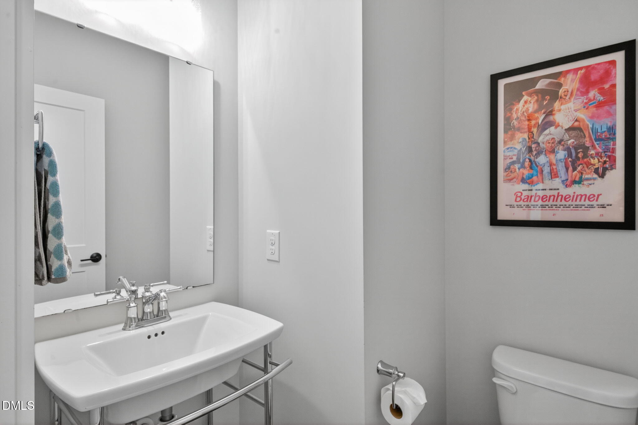 1610 Draper View Loop, Unit 102 Raleigh, NC 27608 - Photo 20 of 40 a bathroom with a toilet a sink and mirror