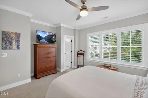 a bedroom with bed and window
