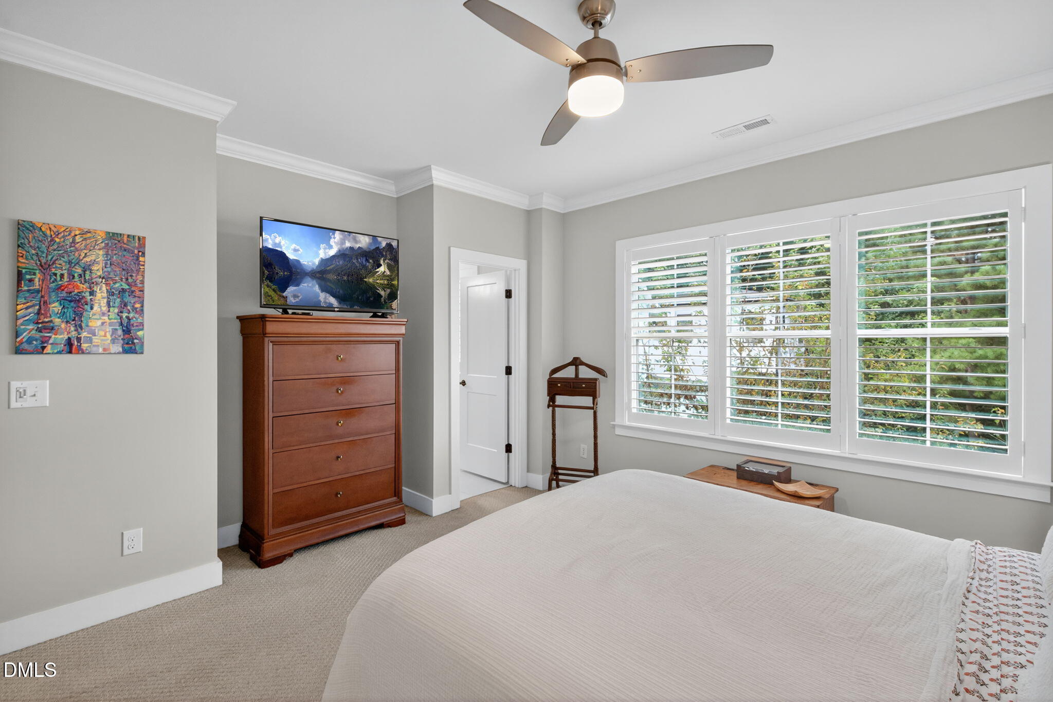 1610 Draper View Loop, Unit 102 Raleigh, NC 27608 - Photo 23 of 40 a spacious bedroom with a bed and a window