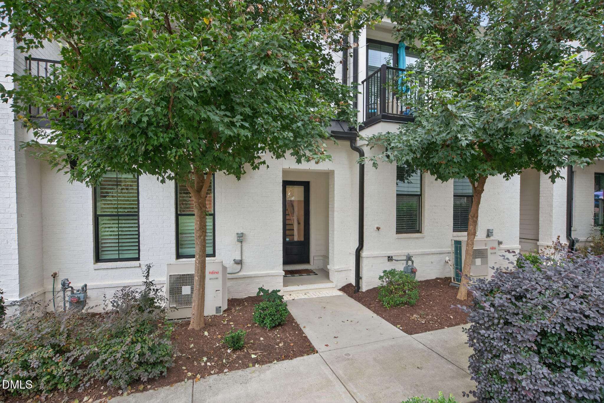 1610 Draper View Loop, Unit 102 Raleigh, NC 27608 - Photo 2 of 40 a front view of a house with garden