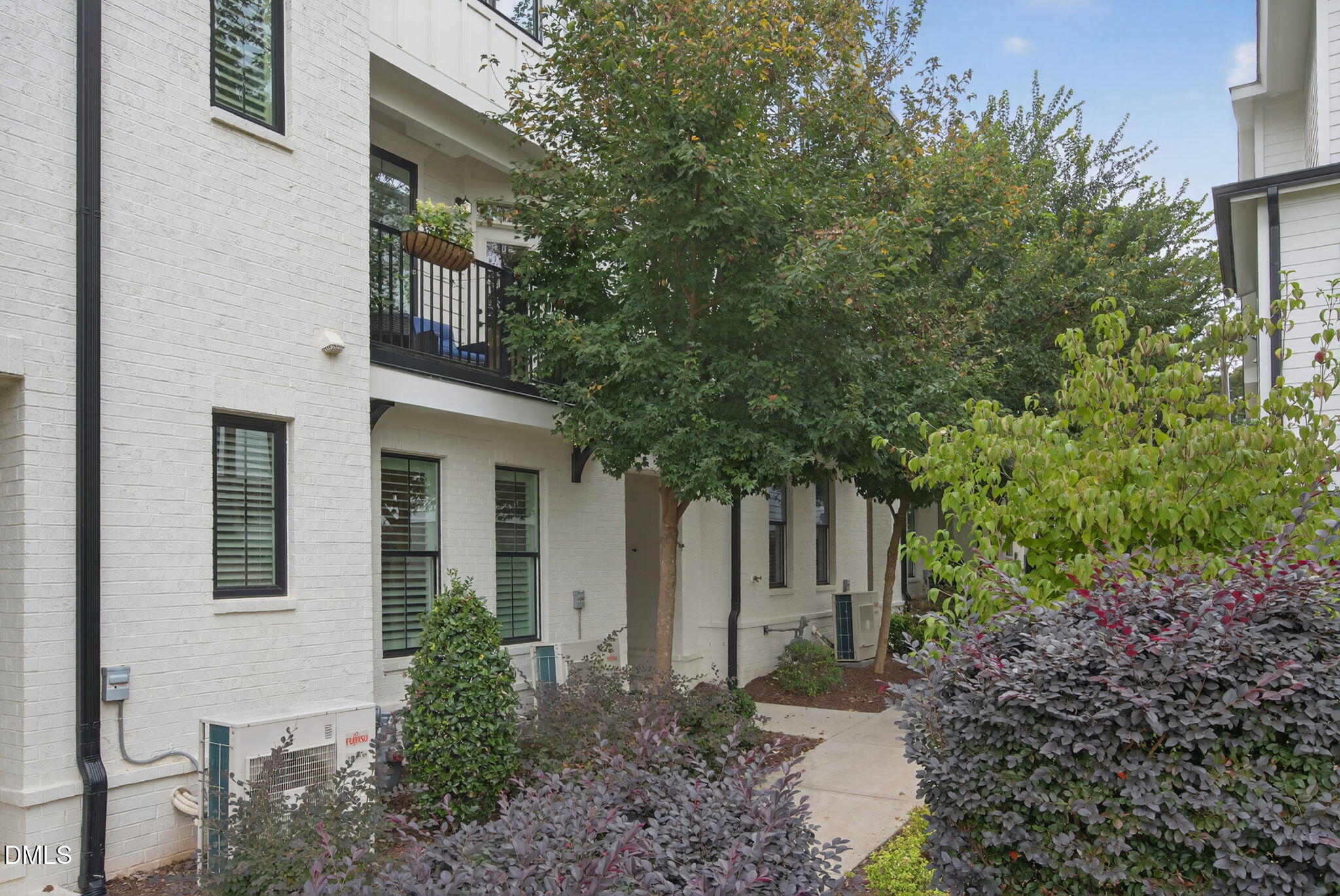 1610 Draper View Loop, Unit 102 Raleigh, NC 27608 - Photo 36 of 40 a front view of a house with garden