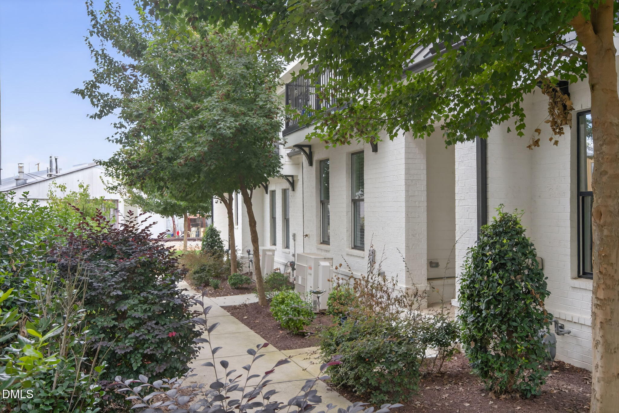 1610 Draper View Loop, Unit 102 Raleigh, NC 27608 - Photo 37 of 40 a front view of a house with garden