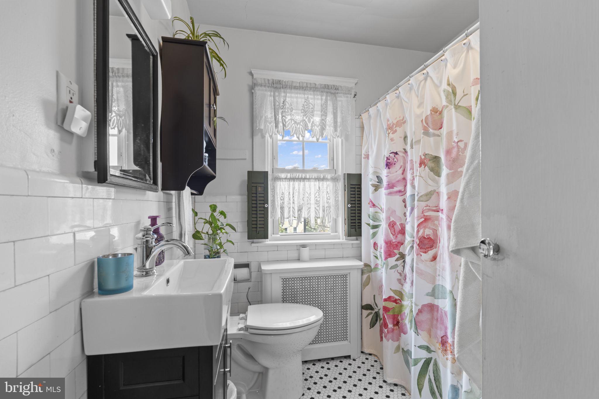 330 Burmont Road Drexel Hill, PA 19026 - Photo 21 of 35 a bathroom with a sink toilet and shower
