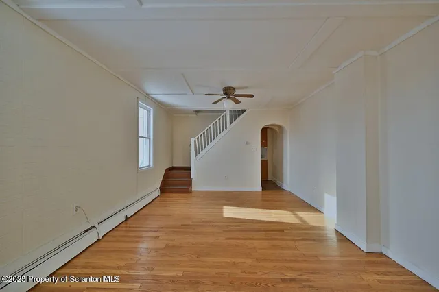 a view of entryway with wooden floor