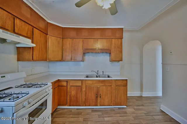 a kitchen with a sink and cabinets