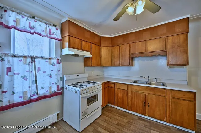 a kitchen with a stove and a sink