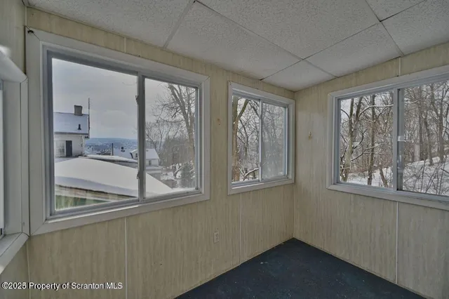 a view of an empty room with a window