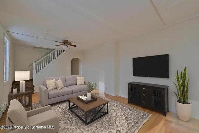 a living room with furniture and a flat screen tv