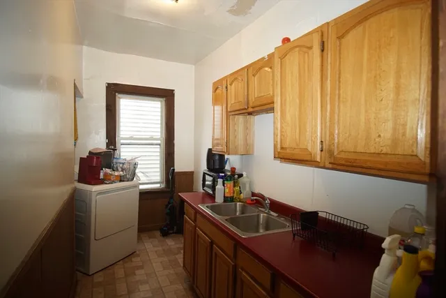 a kitchen with a sink and cabinets