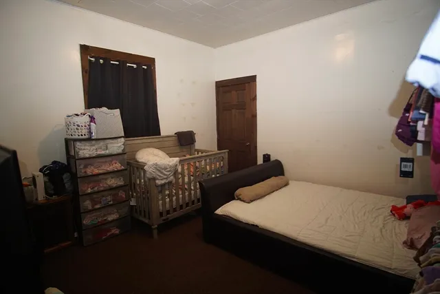 a bedroom with a bed and a closet