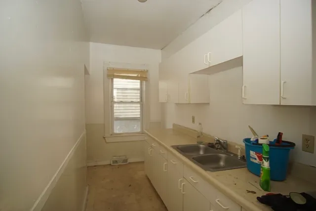 a kitchen that has a sink and a stove