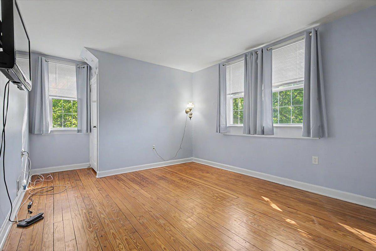 1010 Red Lion Road New Castle, DE 19720 - Photo 38 of 45 wooden floor in an empty room with a window
