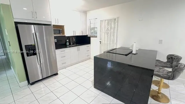 a kitchen with stainless steel appliances a refrigerator and a stove