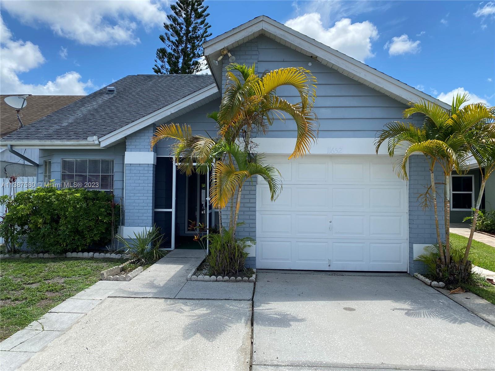 11652 Sunshine Pond Road Tampa, FL 33635 - Photo 1 of 39 a view of a house with a yard