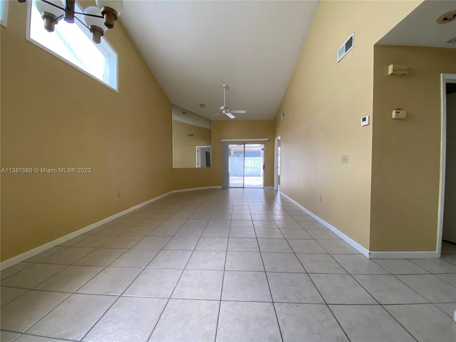 11652 Sunshine Pond Road Tampa, FL 33635 - Photo 13 of 39 a view of an empty room with a window