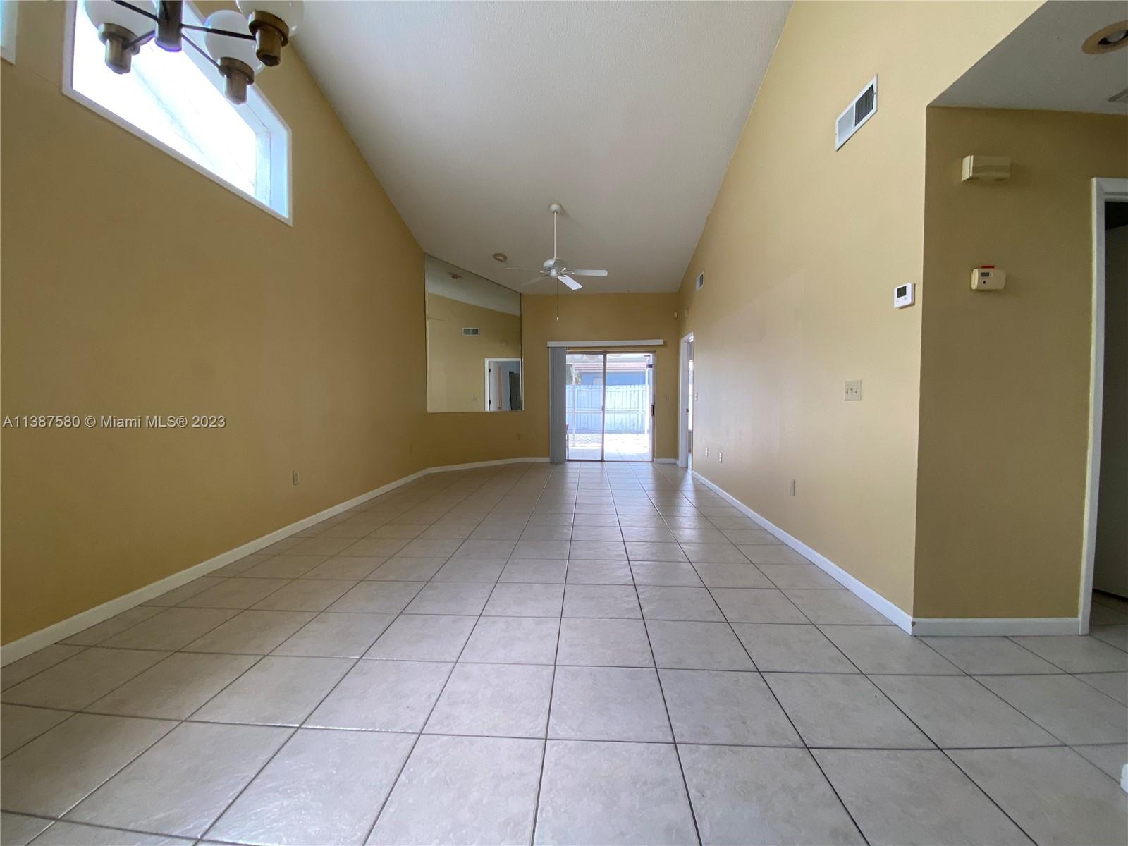11652 Sunshine Pond Road Tampa, FL 33635 - Photo 14 of 39 a view of an empty room with a window