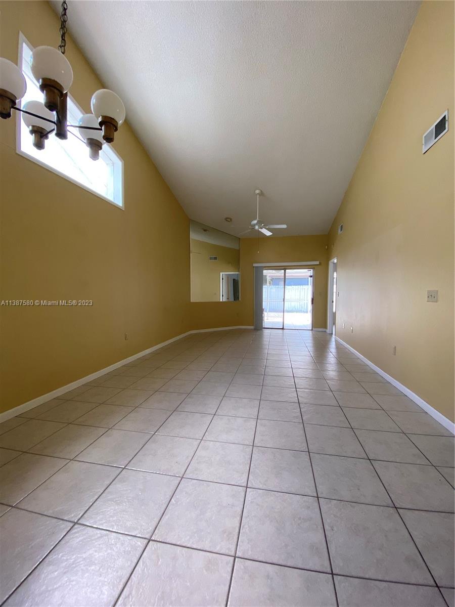 11652 Sunshine Pond Road Tampa, FL 33635 - Photo 15 of 39 a view of a livingroom with wooden floor and a window