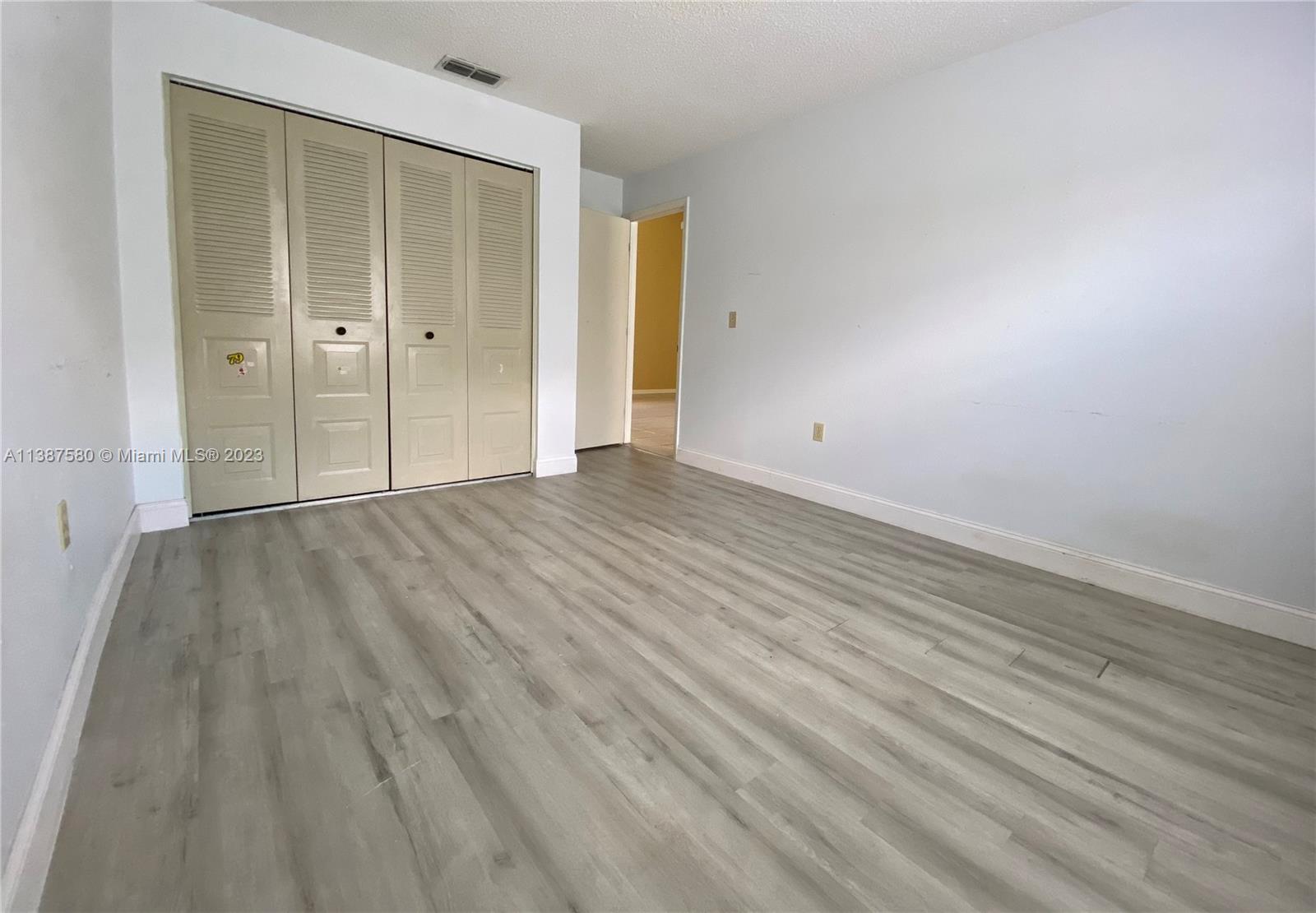 11652 Sunshine Pond Road Tampa, FL 33635 - Photo 16 of 39 wooden floor in an empty room