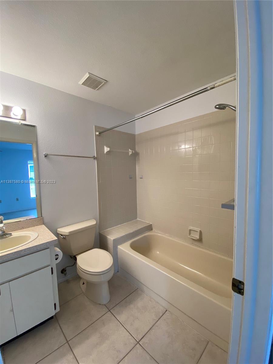 11652 Sunshine Pond Road Tampa, FL 33635 - Photo 22 of 39 a bathroom with a sink a toilet and shower
