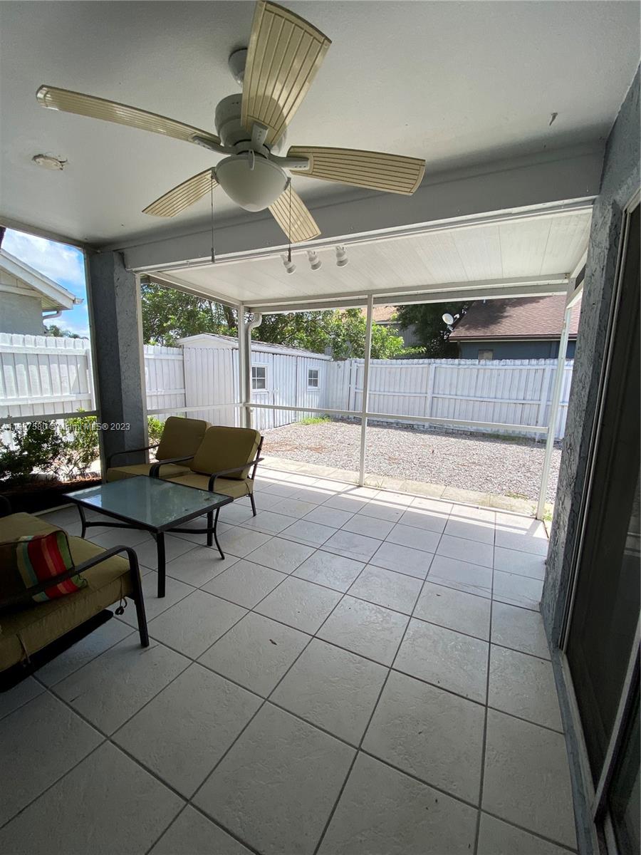 11652 Sunshine Pond Road Tampa, FL 33635 - Photo 23 of 39 a living room with a table and chairs