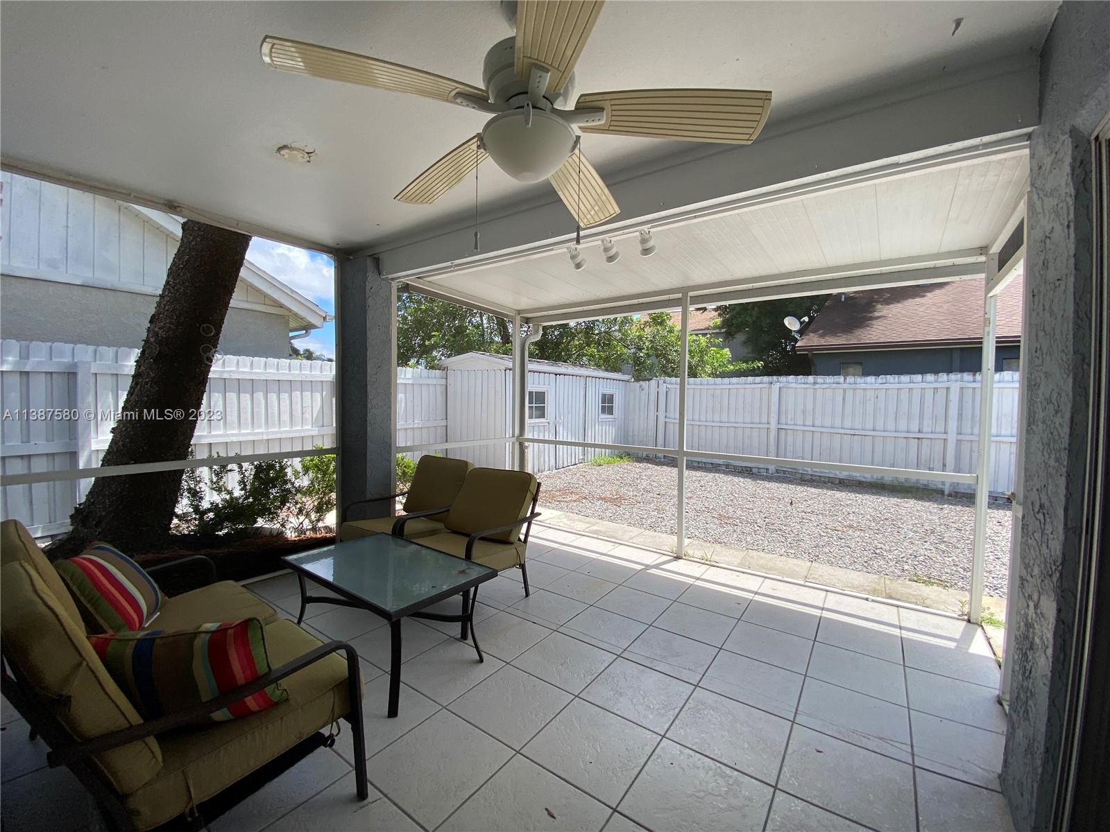 11652 Sunshine Pond Road Tampa, FL 33635 - Photo 24 of 39 a living room with furniture and a large window
