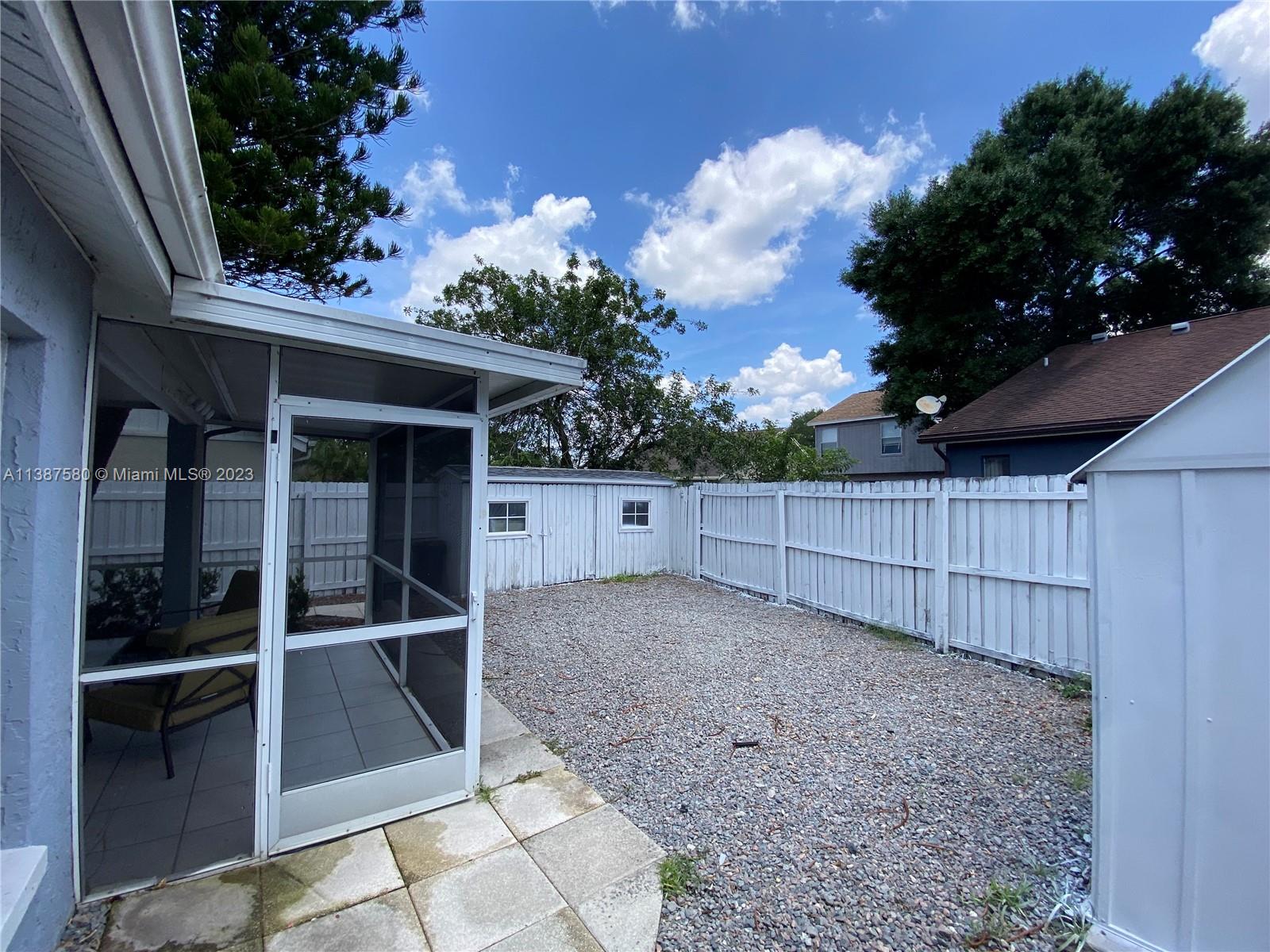 11652 Sunshine Pond Road Tampa, FL 33635 - Photo 26 of 39 a view of backyard and tree