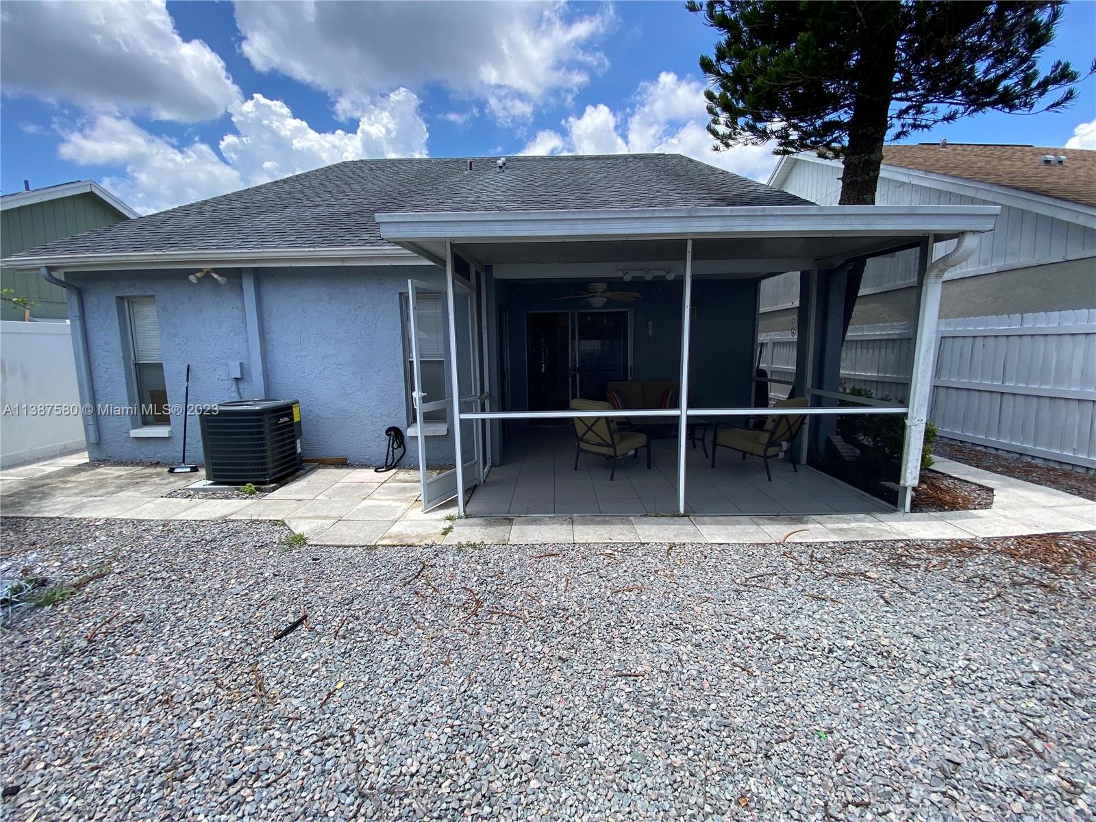 11652 Sunshine Pond Road Tampa, FL 33635 - Photo 27 of 39 a front view of a house with a yard