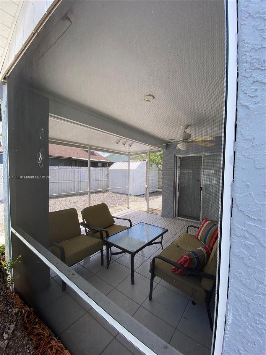 11652 Sunshine Pond Road Tampa, FL 33635 - Photo 30 of 39 a living room with furniture and a window