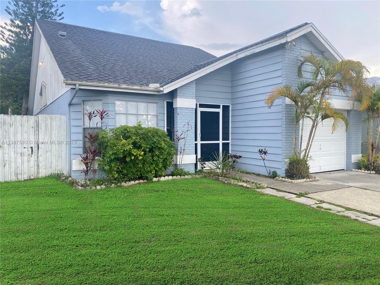 11652 Sunshine Pond Road Tampa, FL 33635 - Photo 4 of 39 a view of a house with a yard