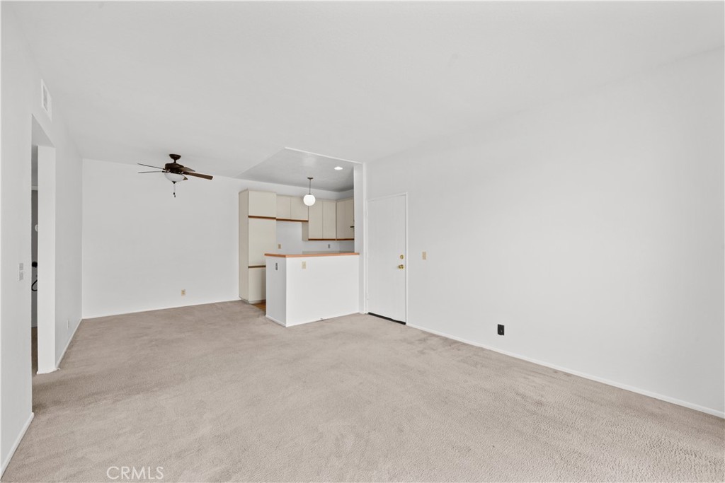 27645 Susan Beth Way, Unit A Saugus, CA 91350 - Photo 6 of 26 an empty room with a kitchen