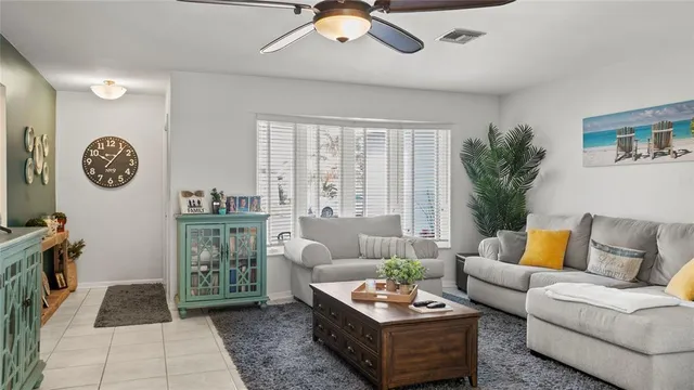 a kitchen with granite countertop sink table and chairs