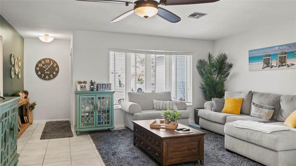 223 Southeast 7th Street Dania Beach, FL 33004 - Photo 13 of 50 a living room with furniture and a large window