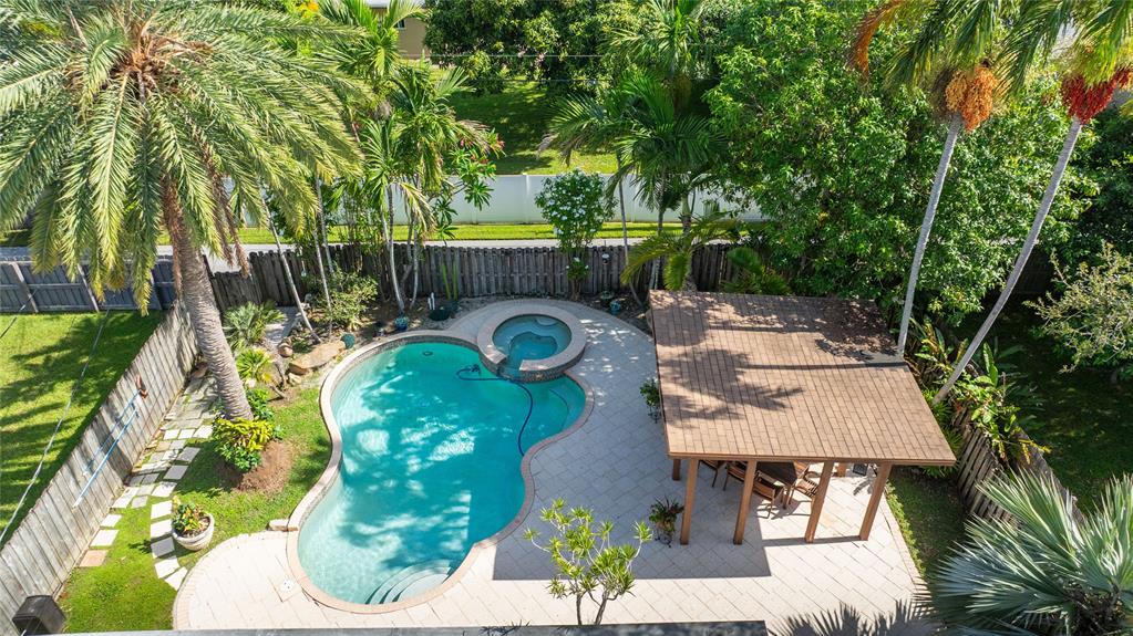 223 Southeast 7th Street Dania Beach, FL 33004 - Photo 2 of 50 an aerial view of a swimming pool with a yard and seating area