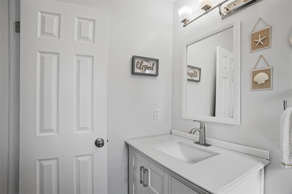 223 Southeast 7th Street Dania Beach, FL 33004 - Photo 33 of 50 a bathroom with a sink vanity and a mirror