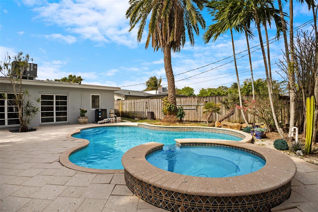 223 Southeast 7th Street Dania Beach, FL 33004 - Photo 42 of 50 a view of a house with swimming pool and sitting area