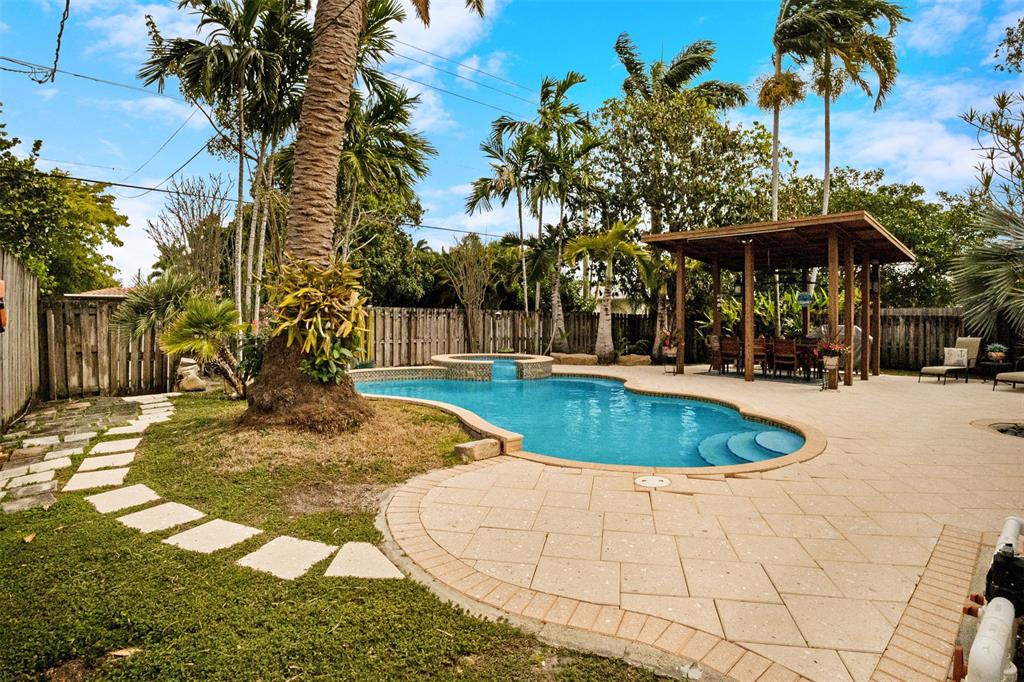 223 Southeast 7th Street Dania Beach, FL 33004 - Photo 44 of 50 a view of a swimming pool with a patio