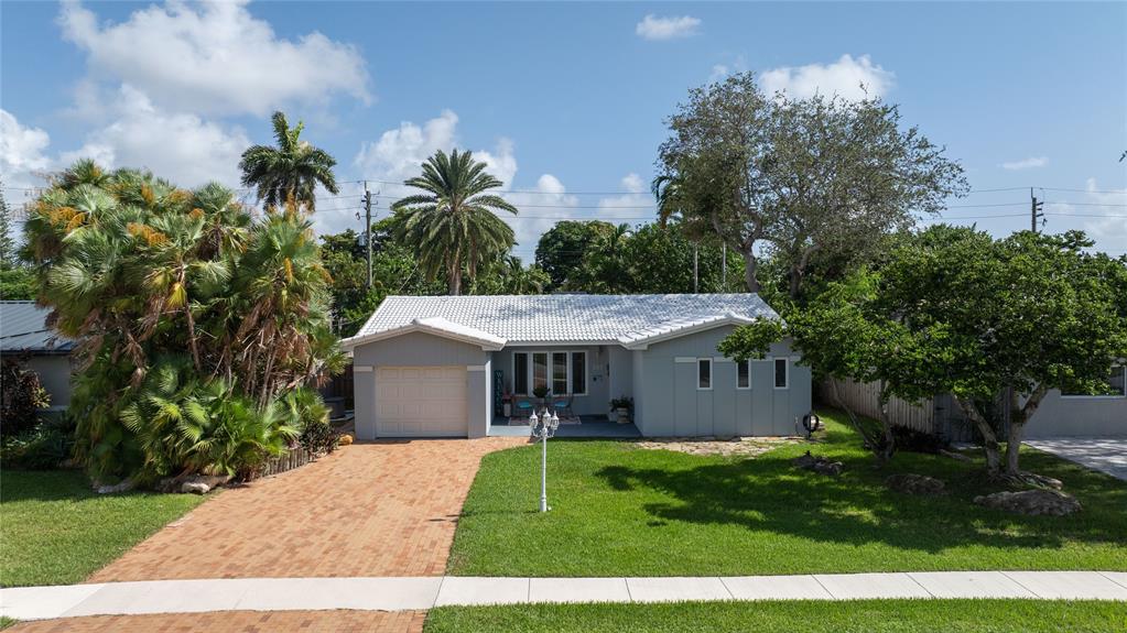 223 Southeast 7th Street Dania Beach, FL 33004 - Photo 5 of 50 a aerial view of a house with a yard and potted plants