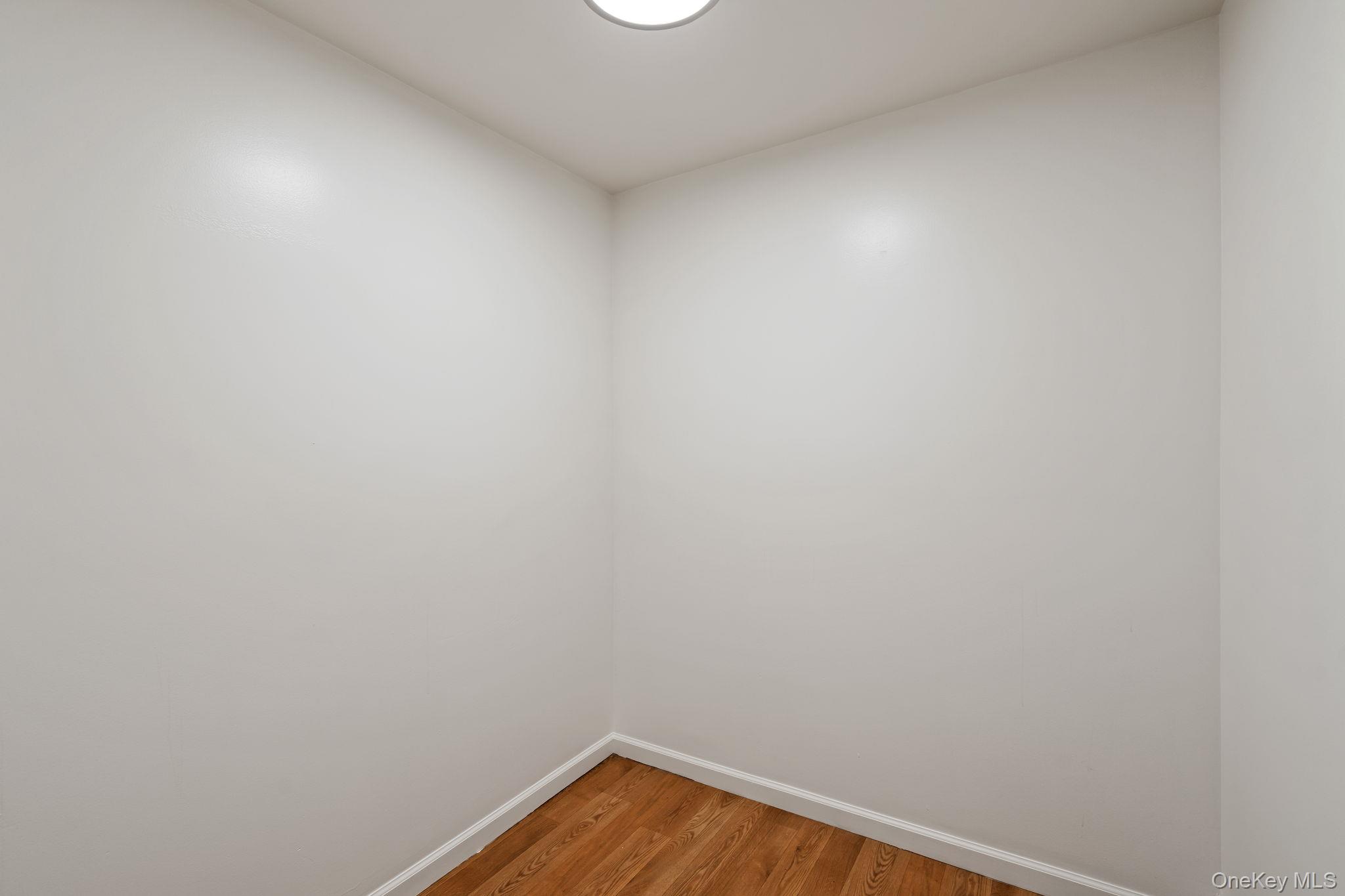 93 Delafield Street Poughkeepsie, NY 12601 - Photo 13 of 27 Unfurnished room featuring light wood-style floors and baseboards