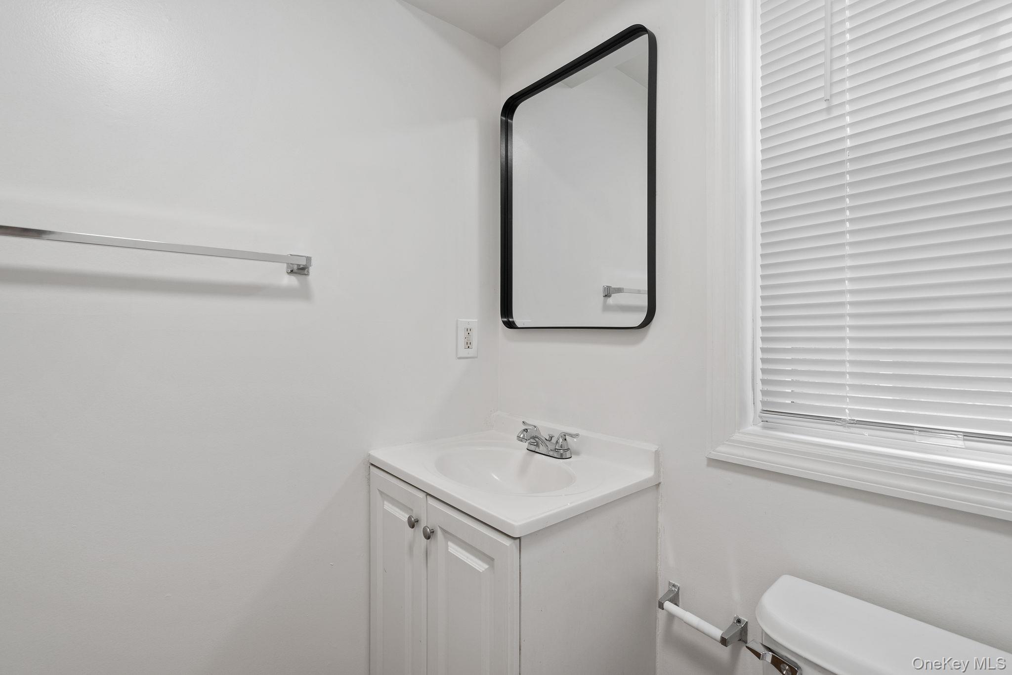 93 Delafield Street Poughkeepsie, NY 12601 - Photo 19 of 27 Bathroom with vanity and toilet