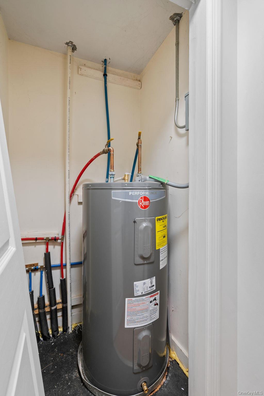 93 Delafield Street Poughkeepsie, NY 12601 - Photo 21 of 27 Utility room featuring water heater