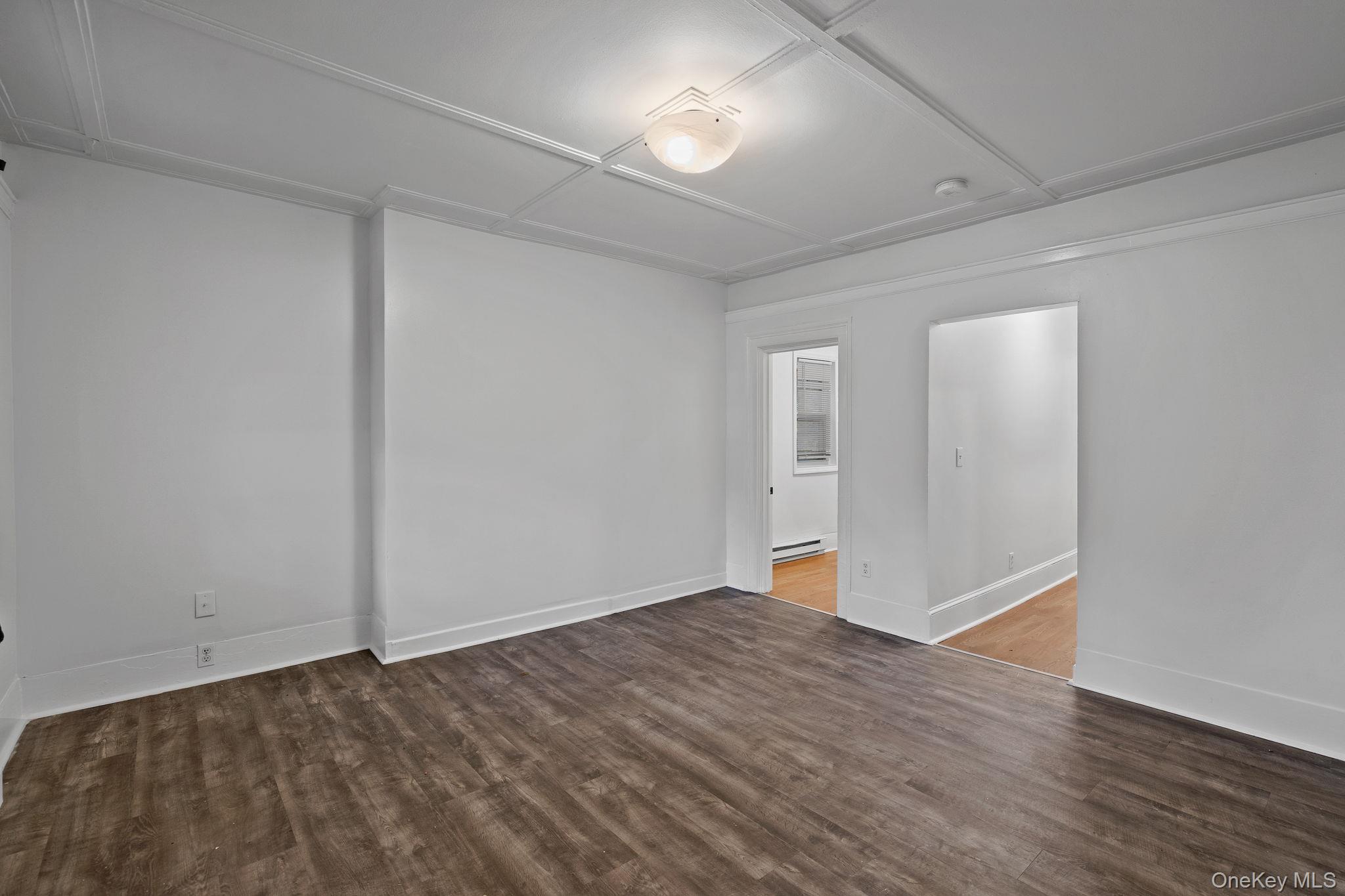 93 Delafield Street Poughkeepsie, NY 12601 - Photo 4 of 27 Unfurnished room with wood finished floors and baseboards
