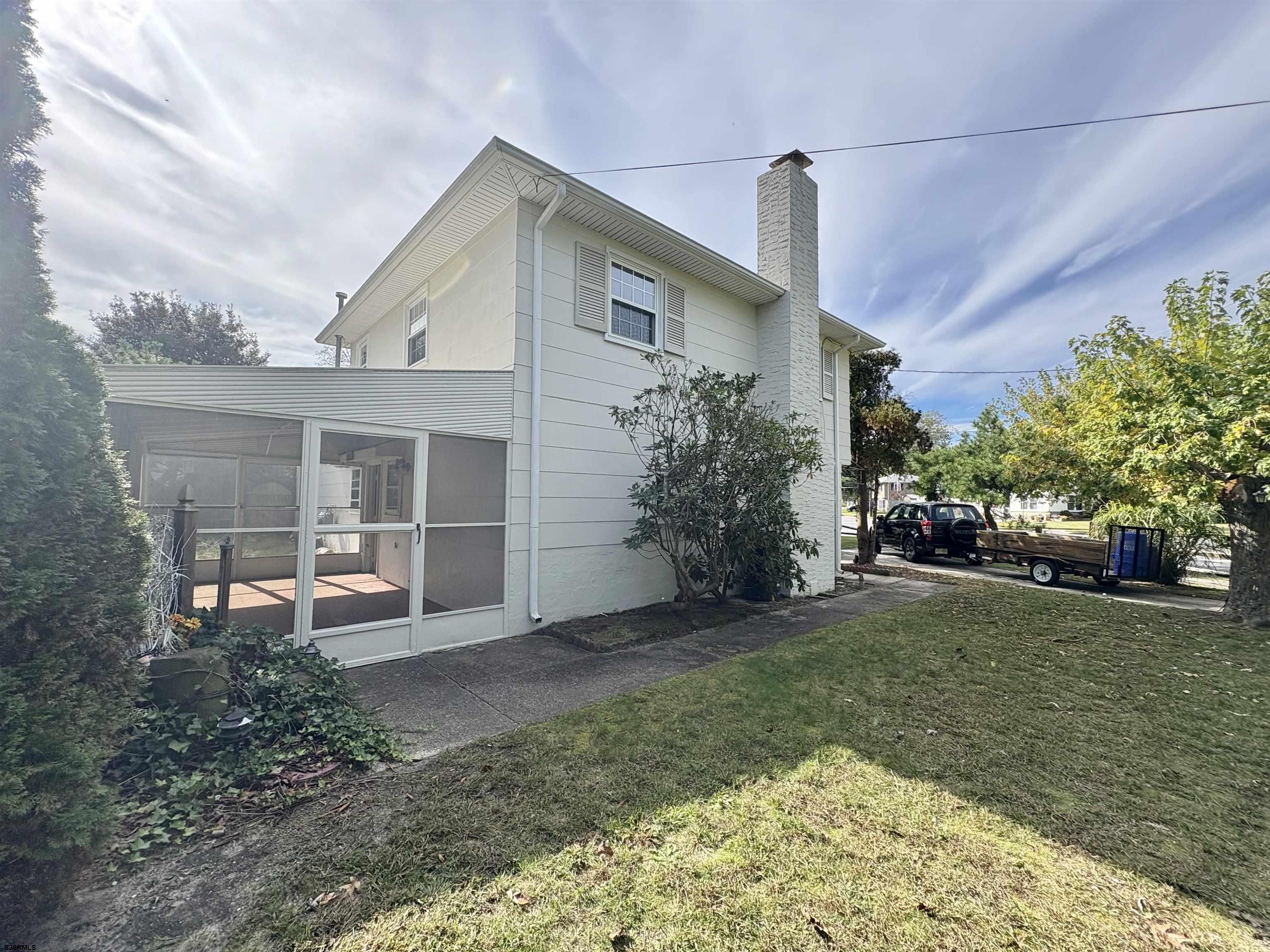 101 Haddon Road Somers Point, NJ 08244 - Photo 16 of 18 a front view of a house with garden
