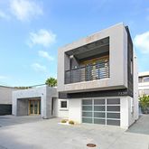a front view of a house with a large window