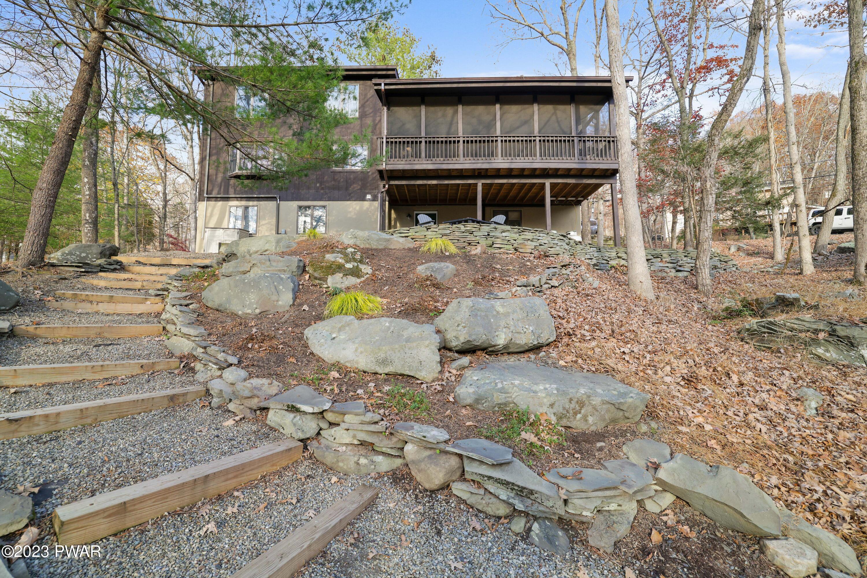 6348 Decker Road Bushkill, PA 18324 - Photo 32 of 36 a view of a backyard with table and chairs and potted plants