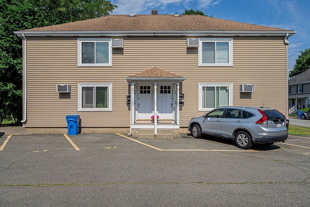 14 Hartwell Street, Unit B Waltham, MA 02453 - Photo 20 of 24 a view of a car in front of a house