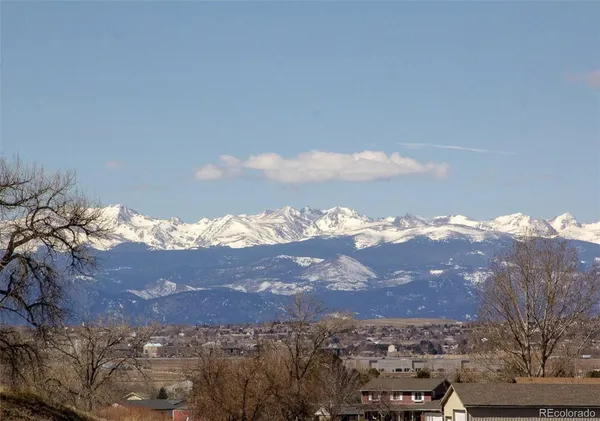 a view of a big yard with mountain