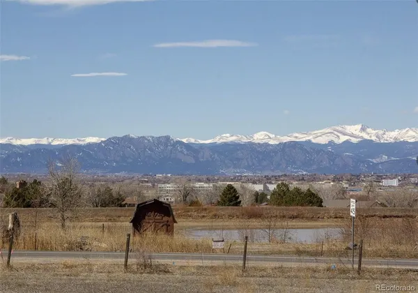 a view of a big yard with mountain