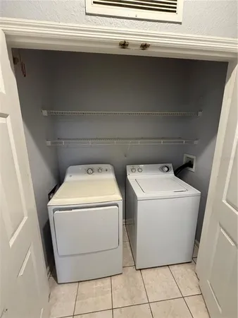 a kitchen with stainless steel appliances and a refrigerator